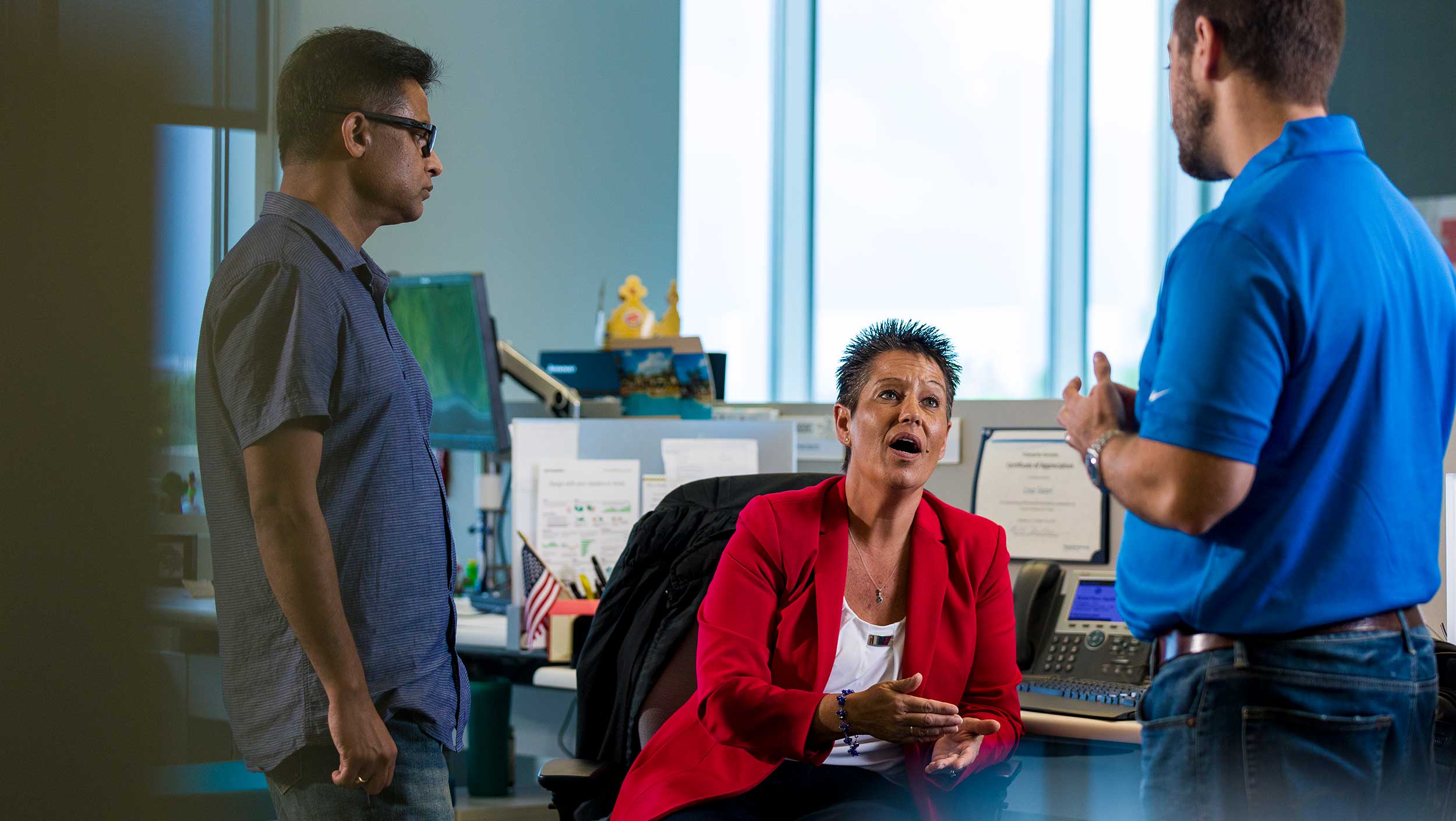 A group of people talking in an office in Florida